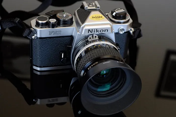 nikon fe2 silver, with lens and hood